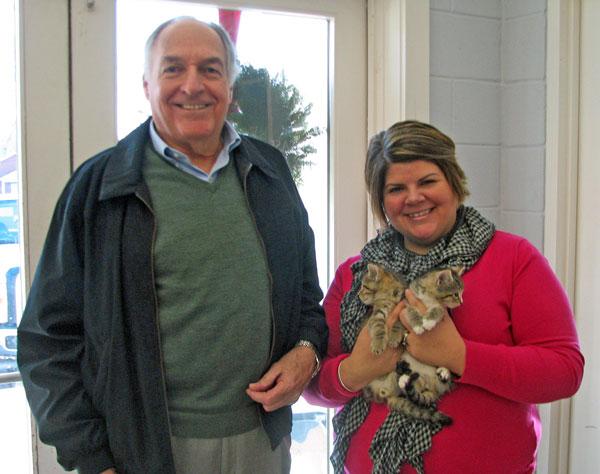 Vernon Nily, left, of the St. John Foundation, congratulates Patty Quimby, Executive Director of Talbot Humane on doubling its goal through the agency’s holiday appeal and matching gift campaign along with two “matching” friends. 