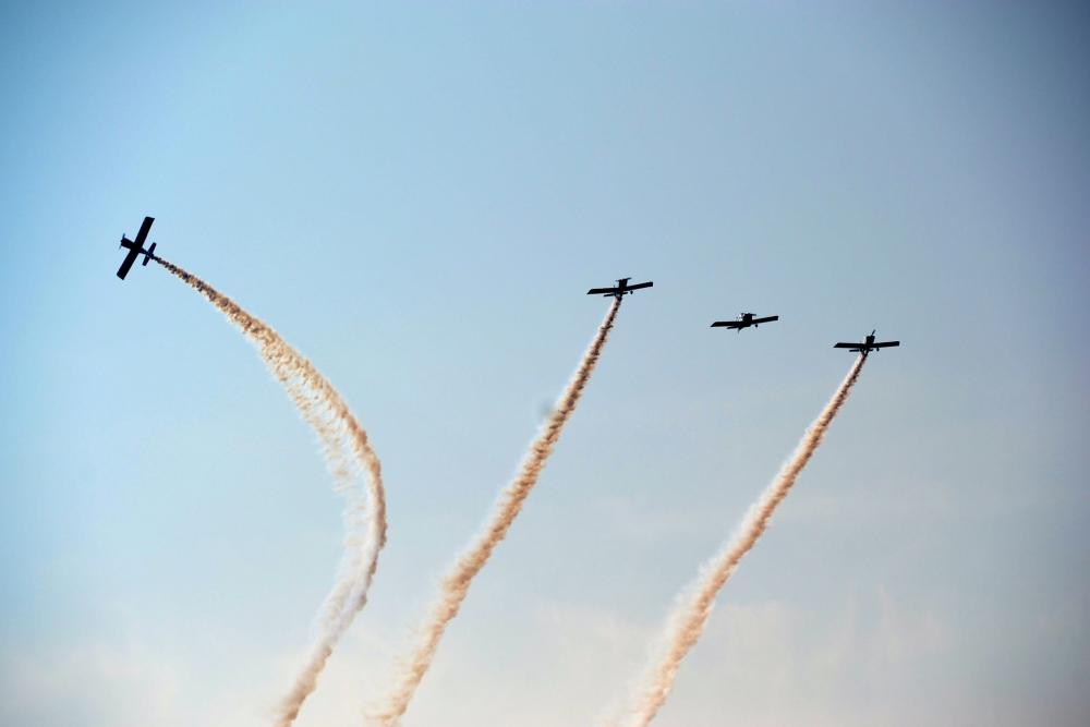 plane formation with smoke