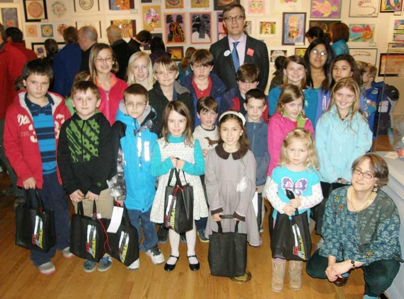  Pictured are student winners of door prizes at the recent opening of the Mid-Shore Student Art Exhibition for grades kindergarten through grade eight at the Academy Art Museum.  Pictured back row with the children is Museum Director Erik Neil and front row, far right, is Constance Del Nero, Director of ArtReach and Community Programs at the Academy Art Museum. 