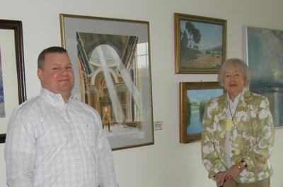 Pictured perusing Londonderry’s resident art work at the recent Spring Event are board member, Darian Sump and Londonderry resident Peggy Rogers.