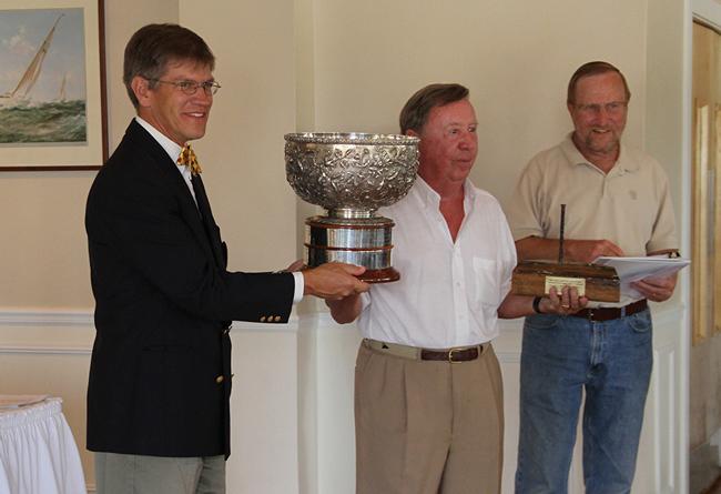 Pete Lesher (holding the ‘Bartlett Cup’) - Chef Curator, CBMM; John C. North, II, winning skipper -Island Bird; and Frank DeBord, Past Commodore and Sail Chair – Miles River Yacht Club.
