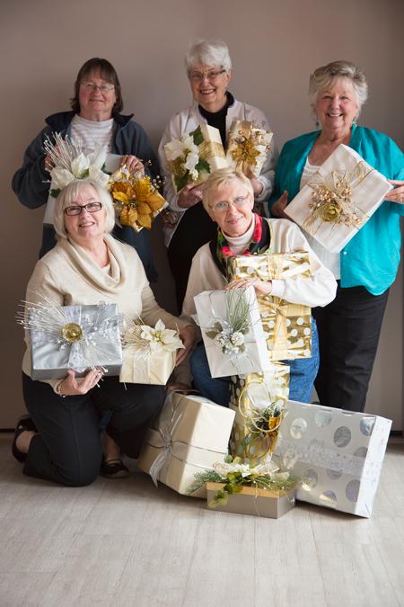 WMA members with some of the artist-created packages that will be a part of the Opening Night décor.  Front row: Ann Geiger and Nancy Snyder.  Back row: Wendy Rue, Jean Browne and Kay Jones.