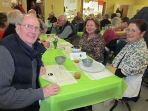 Suzi  Peel, Karen Baker and Jerry Sweeney enjoying the 2013 Empty Bowls Community Dinner. (Enjoying the Dinner)