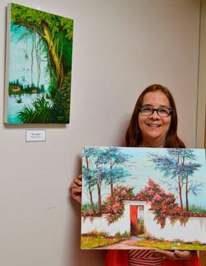 Maria D’Arcy, Breast Center Community Outreach Worker, has two original paintings in the latest gallery exhibit, which are entitled “Altagracia” and “The Jungle.”  Several members of the local community have also entered pieces. 