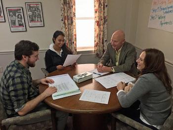 Left to right, Dylan North, Perri Smith, Murph Brangenberg and Jenn Williams prepare to practice their skills using a role play format during a mediation training session.