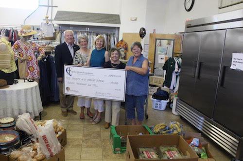 Volunteers receive a grant of $11,000 to buy at walk-in refrigerator for the food pantry at the St. Vincent de Paul center on Canvasback Drive in Easton. From left to right: Alex Handy and Gloria Freihage, St. Vincent de Paul; Jane Kasper and  Brenda Crabbs, Quality Health Foundation; and Kathy Weaver, St. Vincent de Paul food pantry manager.