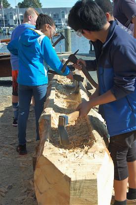 Participants in CBMM’s Rising Tide after school boatbuilding program take their turn carving a traditional dugout canoe. On Thursday, November 5 from 10:00 a.m. to 2:00 p.m. at the Talbot County Free Library in Easton, Md., Chesapeake Bay Maritime Museum Shipwright Educator Matt Engel will share hands-on experience of historic Chesapeake Bay dugout canoe carving and provide information on CBMM’s Rising Tide after-school boatbuilding program. 